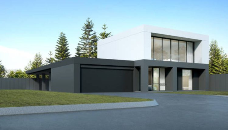 Black Garage Door Against a White House