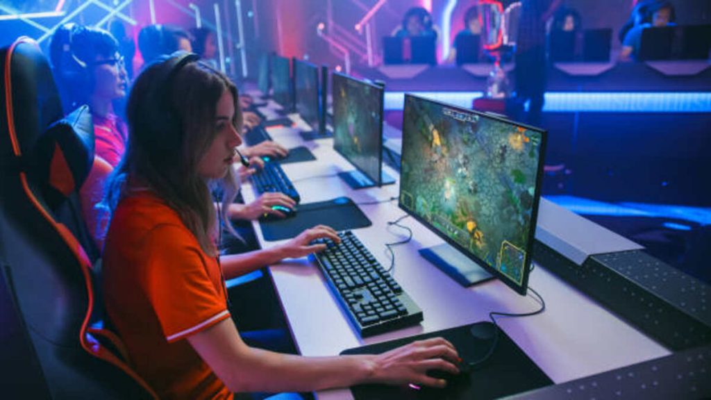 pro girl plays computer game plays rpg strategy on a championship diverse esport team of pro